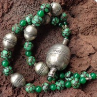 Large, ancient silver pendant from Turkmenia; 6 large silver beads from Afghanistan; Majapahit beads – copies of medieval beads from Java - and Chinese jade length: 50 + 8 cm, weight: 109 g, prize: € 135,-