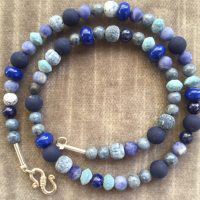 Muliple small blue beads: Lapis, Sodalith, Sponge Coral, tinted Lava